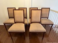 Front view of all six Regency style oak dining chairs