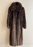 Front view of full-length raccoon fur coat