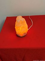 Glowing Himalayan salt lamp showing working condition