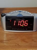 Front view showing red LED display, controls and projector housing