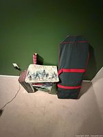 Lot overview showing wrapping paper rolls, storage bag, decorative box stack