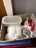 Overall view of storage tote containing the listed Christmas decorations