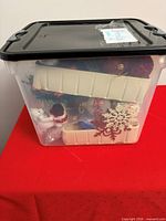 Clear bin showing assorted Christmas décor items