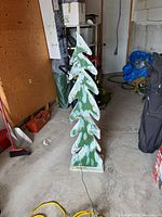 Tall painted wooden Christmas tree decoration with cord