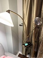 Full view of lamp showing shade, arm, magnifier and tray