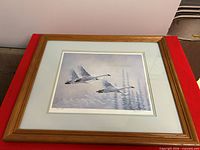 Overall view of framed signed numbered geese print