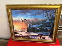Front view of framed winter scene painting