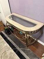 Full view of marble top brass console table
