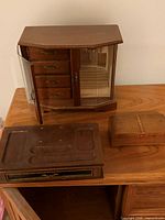 Overall view of three wooden jewelry boxes