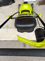 Top view of green Sun Joe cordless mower handle and deck