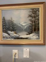 Full view of framed winter landscape print on wall