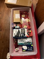 Overall view of bin showing all items listed