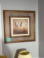 One of the framed floral prints showing matting and frame detail