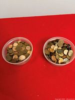 Top view of two containers showing quantity and variety of pennies