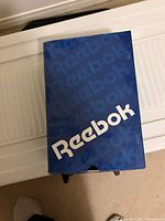 Reebok branded blue shoe box top