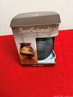 Front of boxed ScentSationals Eclipse art glass warmer