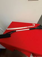 Shoehorn and snow brush laid on table