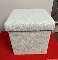 closed cube foot stool showing textured white exterior