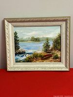 Front view of framed oil landscape painting