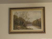 Front view of framed landscape print on wall
