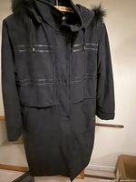 Full front view of black London Fog hooded coat