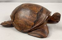 Full view of carved wooden sea turtle from side