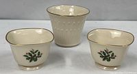 Group view of two Lenox Holiday sugar bowls and Lenox cachepot