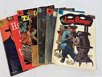Fanned stack of approximately ten Dell comics showing primary titles