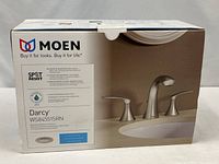 Sealed retail box showing Moen Darcy WS84551SRN faucet kit
