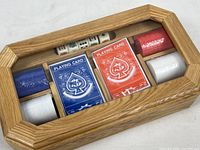 closed wood box showing contents through lid