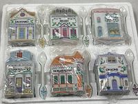 Overview of six cottage jars and six spoons in original foam packing