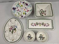 Overhead view of five Portmeirion pieces including deviled egg plate, Water Garden tray, square bowl, rectangular bread server and two small bowls