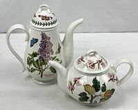 Coffee and tea pots side by side