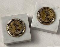 Both marble paperweights side by side