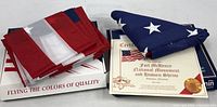 Two folded U.S. flags on Annin boxes