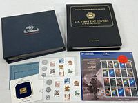 Overview of two first day cover albums and assorted loose stamp items
