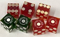 All five dice showing logos and bullseye pips