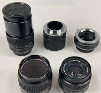 Group shot showing three lenses and two extension tubes