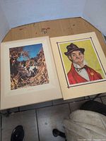 Both prints side by side on table