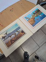 Both prints side by side showing size and themes