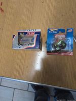 Overview of both packaged toys on table