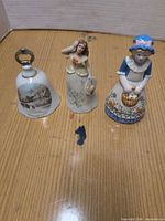 Three bells side-by-side showing overall form and size differences