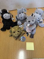 Group of all five Coca-Cola plush animals
