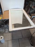 Full view of rectangular mirror showing frame and glass