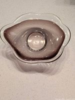 Top view highlighting wavy rim and smoky lavender interior