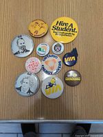 Overall view of all eleven buttons arranged on tabletop