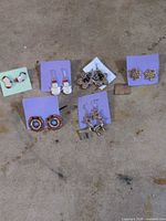 All six pairs of Christmas theme earrings displayed on cards