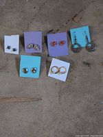 all six pairs displayed on colored squares and concrete background