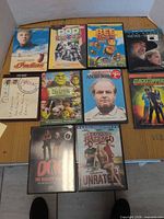 All ten DVDs and Blu-ray cases laid out for overview