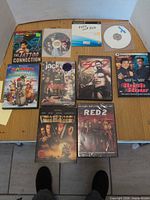 All 10 DVDs and discs laid out